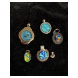 Art crafted pendants 2 have a Sterling setting
