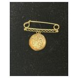 Gold safety pin brooch marked 14K with an M