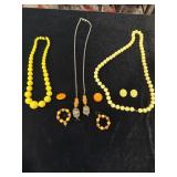 Costume jewelry necklaces and earrings