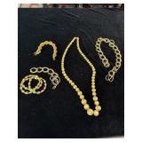 Costume jewelry necklaces and bracelets including