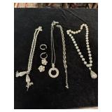 Costume jewelry necklaces and earrings