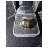 Ring with a smokey quartz style stone marked 835