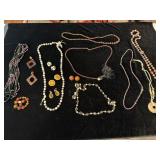 Costume jewelry necklaces and earrings