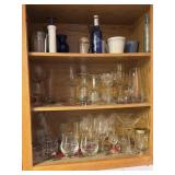 Cabinet contents near sink - Pyrex bowls, pots,