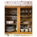 Cabinet contents on stove side of kitchen -