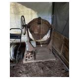 Old cement mixer with cast iron wheels