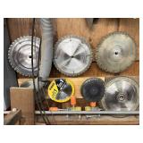 Lot of saw blades on wall (includes