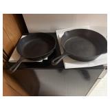 2 Cast iron frying pans - one marked 7 and other 9