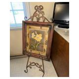 Framed flower attached to easel