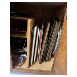 Lower cabinet contents incuding cutting boards,