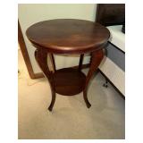 Round side table with curved legs mahogany finish