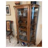 Oak bow front china cabinet with claw feet