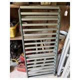 Gravity roller conveyor and set of industrial