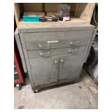 Metal cabinet with folding sides and contents
