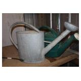 2 Watering cans 1 metal 1 plastic