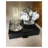 Expresso cups & saucers on a black