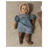 Antique doll with cloth arms and legs, crys when