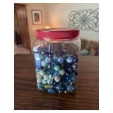 Plastic container of marbles