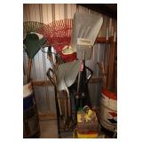 Metal rolling stand with shovels, post hole