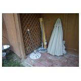 2 iron outdoor umbrella stands with umbrellas