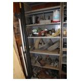 Contents of metal shelving unit - oil cans, cast