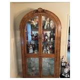 Oak curio cabinet with arched top and lighted