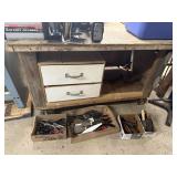 Work table with Columbian vise, putty knives,