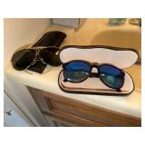 Pair of used Revo Blue Cat sunglasses with case