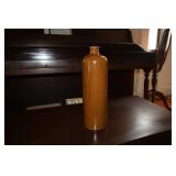 Brown stoneware glazed liquor bottle