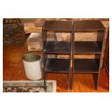 2 Black Particle Board Shelving Units and a Trash
