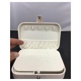 White snap shut portable jewelry case