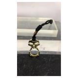 Skull shaped bottle opener with strap