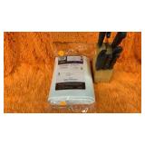 Vinyl tablecloth and kitchen knifes/block