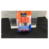 Three giant glue sticks