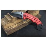 Red Finger Hole Style Knife