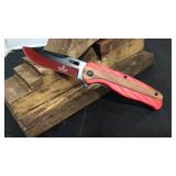 Red plastic/wood handle knife
