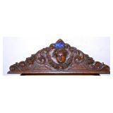 A Victorian Carved Walnut Crest