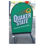 A Quaker State Curb Sign