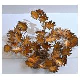 A Cut Metal Leaves Wall Sculpture