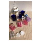 Blue cups with plastic shot glasses measuring Blue cups with plastic shot glasses measuring