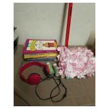 Group of color books, craft paint, headphones