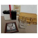 Wicker picnic basket with various supplies,