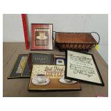 Group of framed artwork with basket