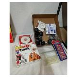 Group of casters, glue sticks, matches, snap hook