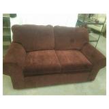 Maroon loveseat hide-a-bed