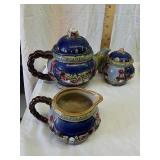 Stoneware decorative teapot with cream and sugar Stoneware decorative teapot with cream and sugar