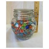 Glass jar full of marbles Glass jar full of marbles