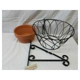 Hanging metal planter basket with terracotta Hanging metal planter basket with terracotta