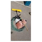 Garden hose with gas can sprayer and snow shovel Garden hose with gas can sprayer and snow shovel