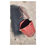 Roll of garden mash with wood planter and rake Roll of garden mash with wood planter and rake